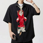Novelty necktie featuring a calico cat wearing a red and black spider-themed hoodie, appearing to hang from a rope