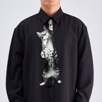 Novelty necktie featuring a realistic hanging tabby cat design, a fun and unique fashion accessory.