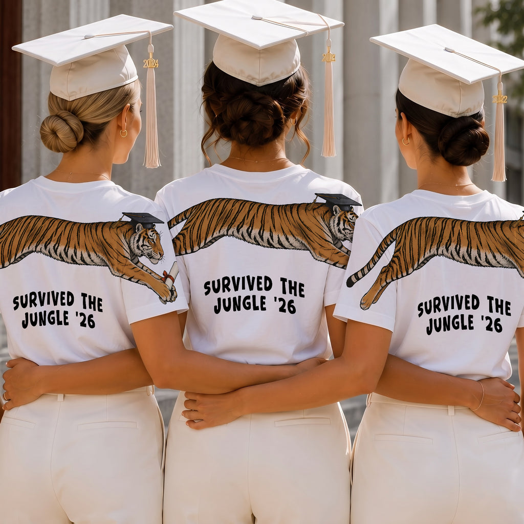 Tiger Survived The Jungle 26 graduation graphic tee by Dripvity, unisex oversized white t-shirt with leaping tiger in graduation cap and diploma