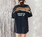 Tiger Survived The Jungle 26 graduation graphic tee by Dripvity, unisex oversized white t-shirt with leaping tiger in graduation cap and diploma
