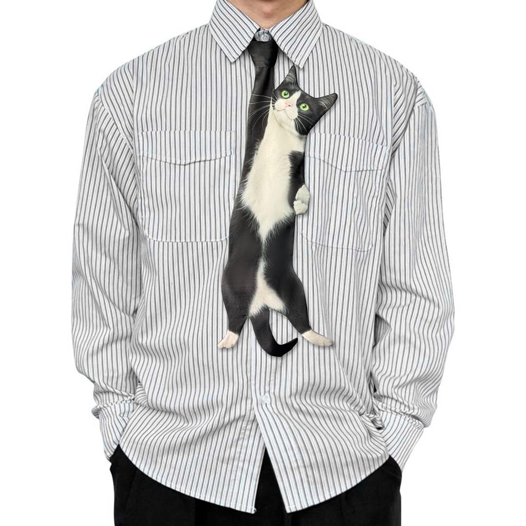Novelty necktie featuring a realistic illustration of a black and white tuxedo cat, a playful and unique fashion accessory for cat lovers.