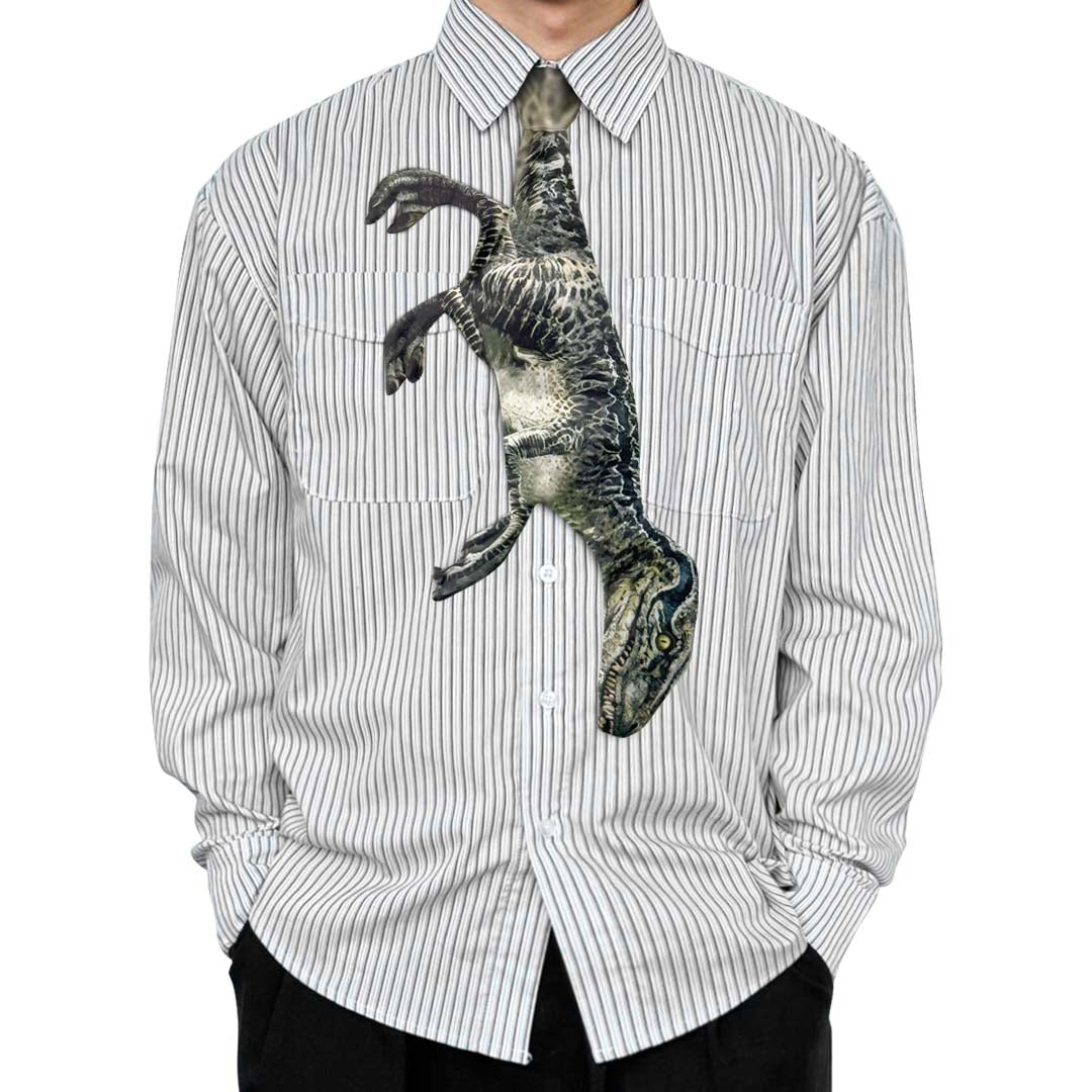Novelty necktie featuring a dynamic illustration of a Velociraptor, a striking and unique fashion accessory for dinosaur enthusiasts and fans of prehistoric creatures.