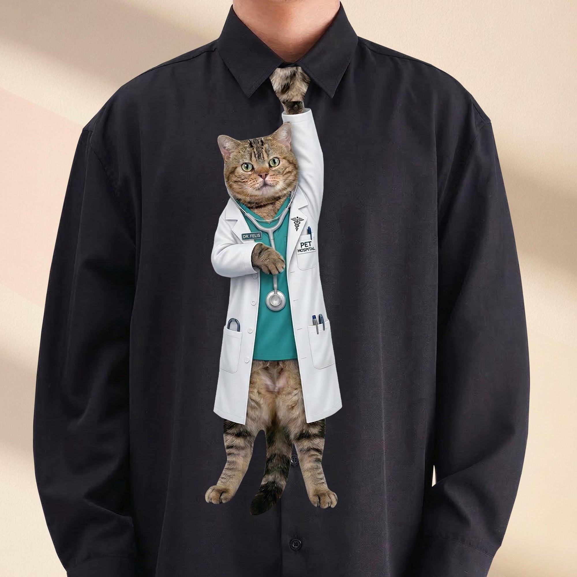 Novelty necktie featuring a tabby cat dressed as a veterinarian in a white lab coat over teal scrubs, with a stethoscope and a 'PET HOSPITAL' badge.