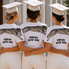 Wolf Howling Outta Here graduation graphic tee by Dripvity, unisex oversized white t-shirt with leaping wolf in graduation cap and diploma