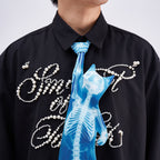 Unique novelty necktie featuring a blue X-ray skeleton design of a cat, an edgy and artistic fashion accessory.