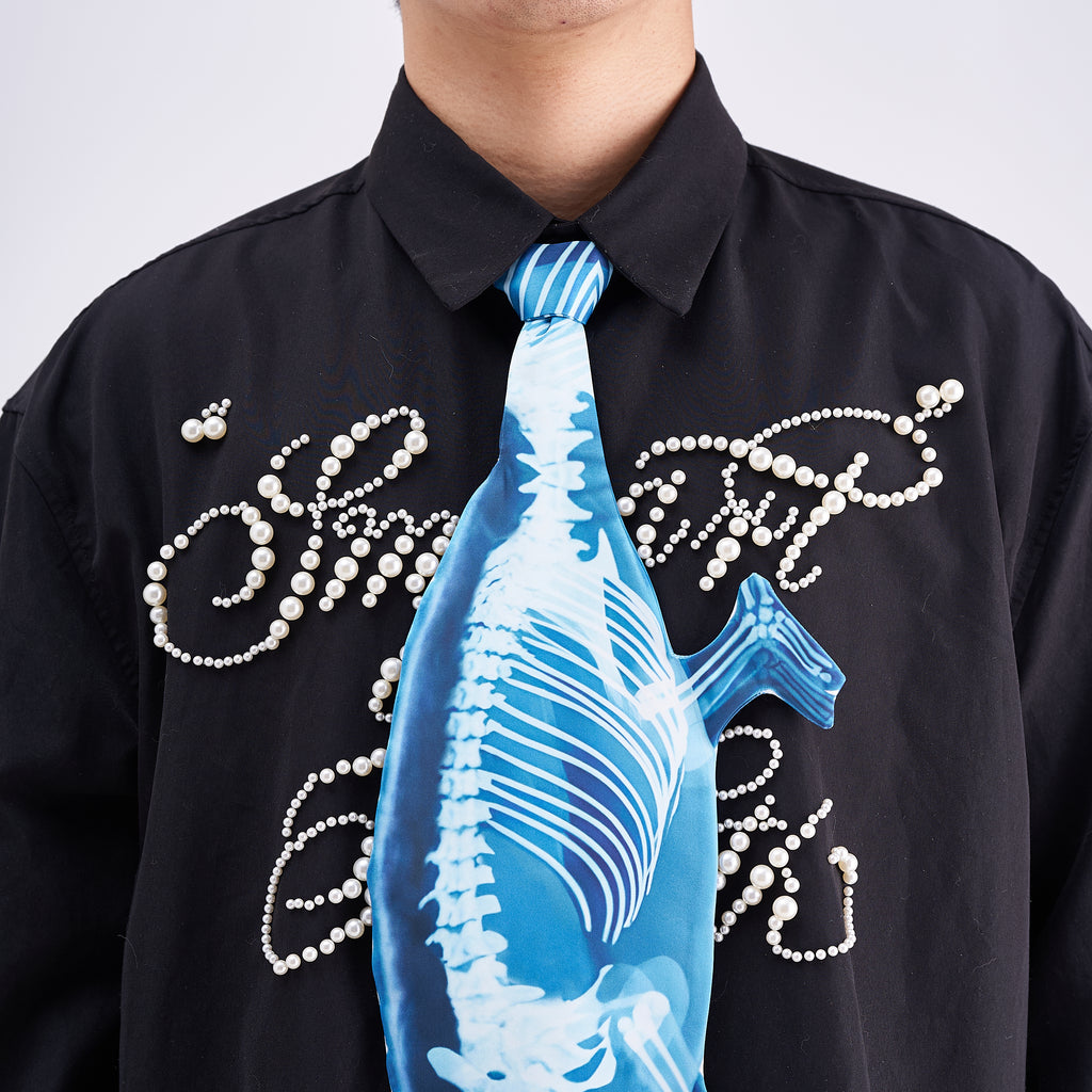 Unique novelty tie featuring a blue X-ray skeleton design of a chameleon, an edgy and artistic fashion accessory for standout looks.