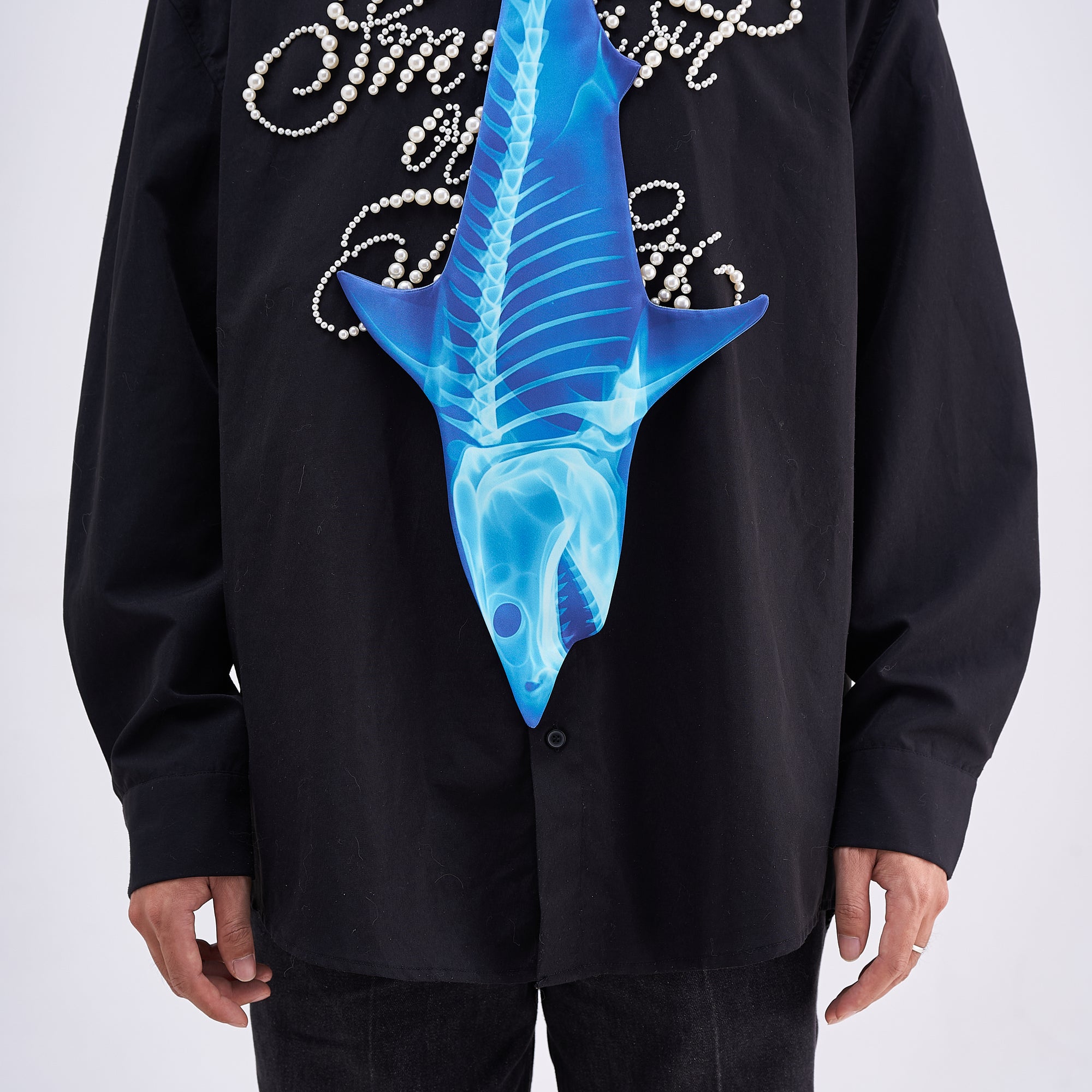 Unique novelty necktie featuring a blue X-ray skeleton design of a shark, a bold and edgy fashion accessory.