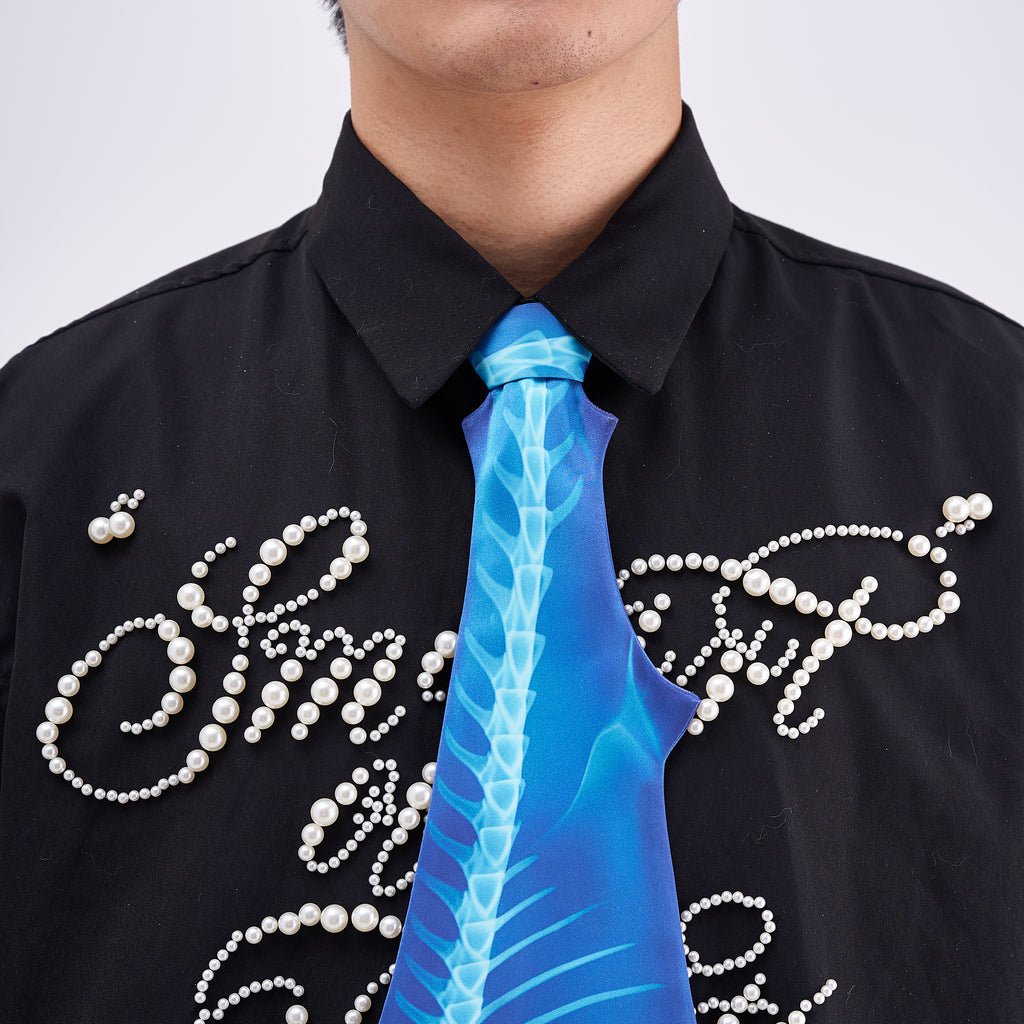 Unique novelty necktie featuring a blue X-ray skeleton design of a shark, a bold and edgy fashion accessory.