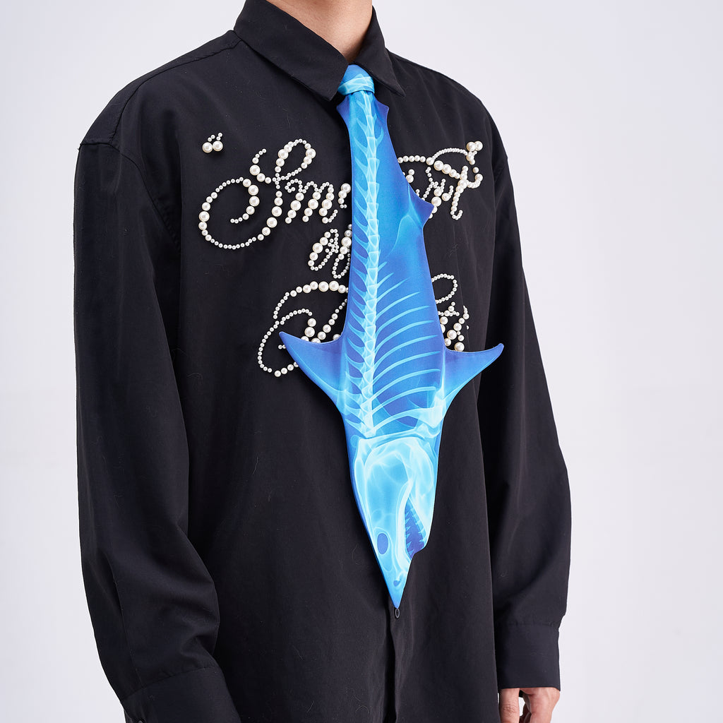 Unique novelty necktie featuring a blue X-ray skeleton design of a shark, a bold and edgy fashion accessory.