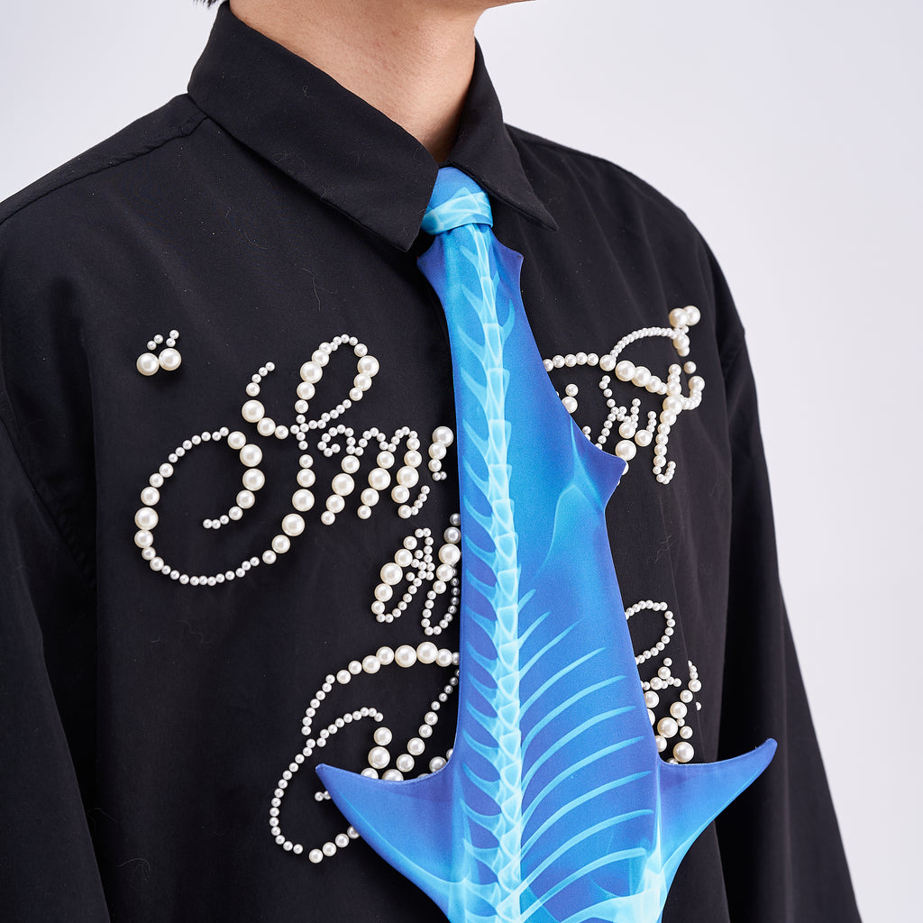 Unique novelty necktie featuring a blue X-ray skeleton design of a shark, a bold and edgy fashion accessory.
