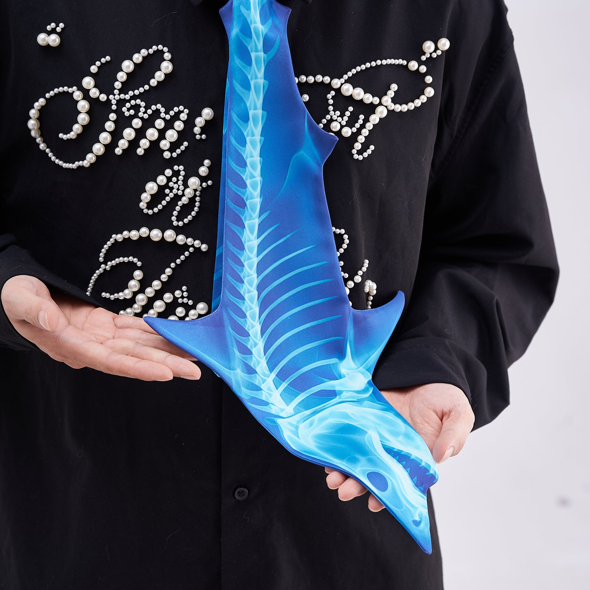 Unique novelty necktie featuring a blue X-ray skeleton design of a shark, a bold and edgy fashion accessory.