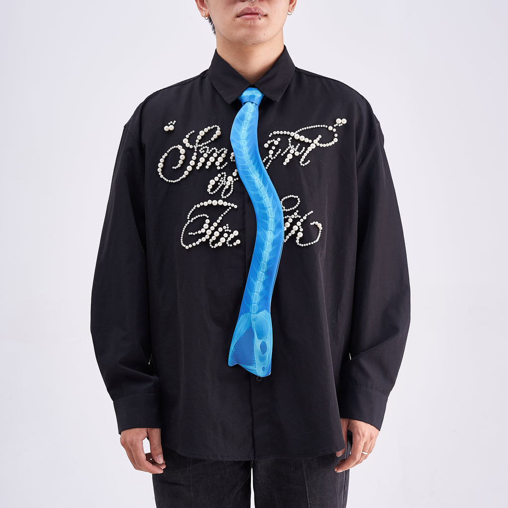 Unique novelty necktie featuring a blue X-ray spine skeleton design, a bold and edgy fashion accessory.