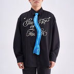 Unique novelty necktie featuring a blue X-ray spine skeleton design, a bold and edgy fashion accessory.