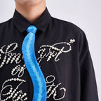 Unique novelty necktie featuring a blue X-ray spine skeleton design, a bold and edgy fashion accessory.