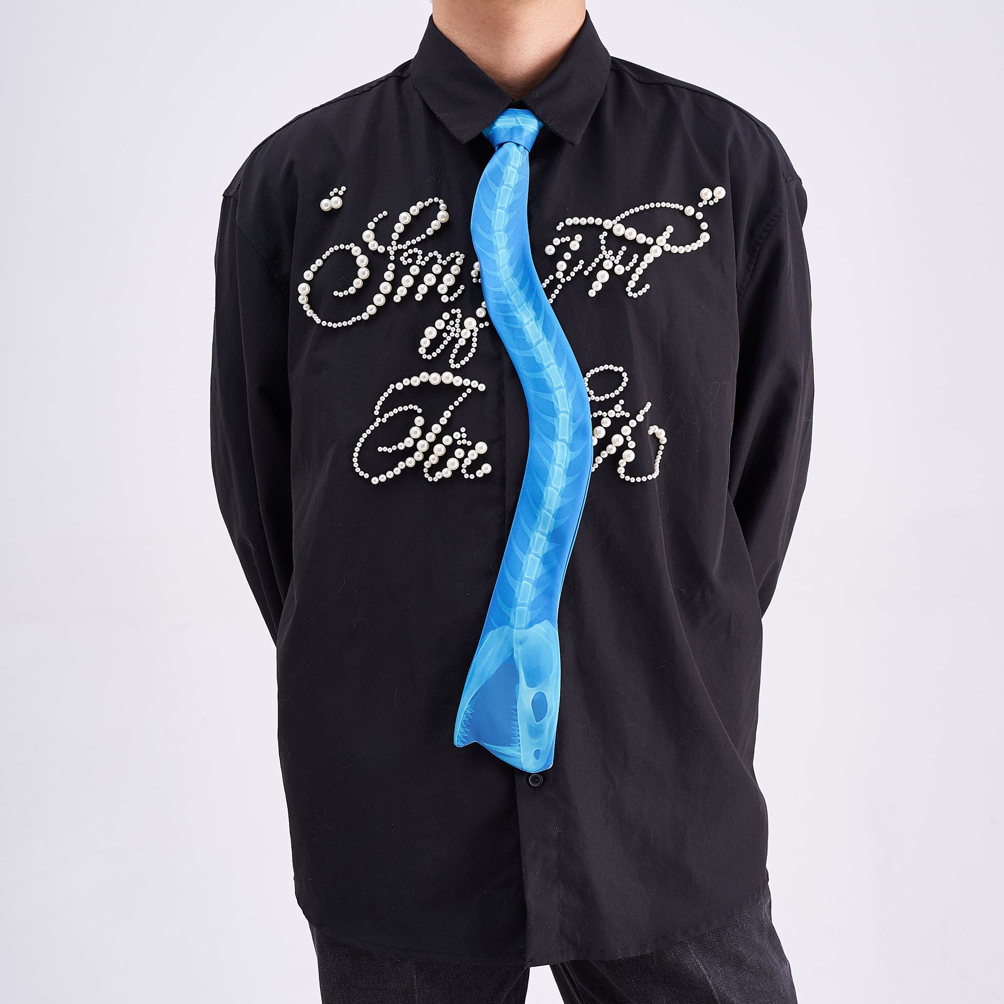 Unique novelty necktie featuring a blue X-ray spine skeleton design, a bold and edgy fashion accessory.