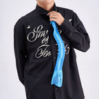 Unique novelty necktie featuring a blue X-ray spine skeleton design, a bold and edgy fashion accessory.