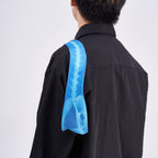 Unique novelty necktie featuring a blue X-ray spine skeleton design, a bold and edgy fashion accessory.